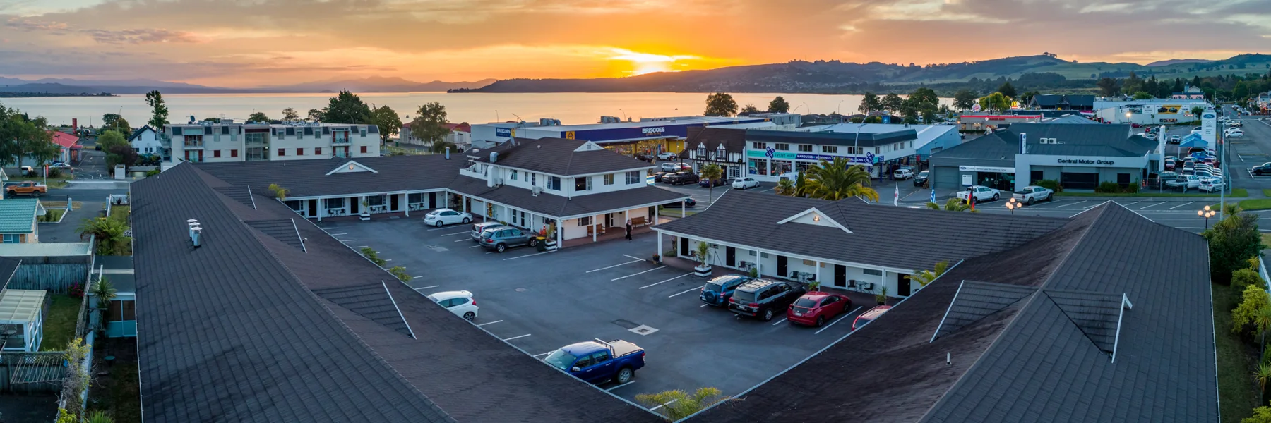 Courtyard parking beside ground-floor units at Prince Motor Lodge